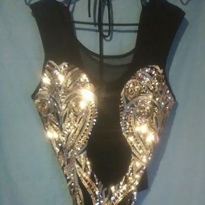 A sequence body top with a sheer skirt.